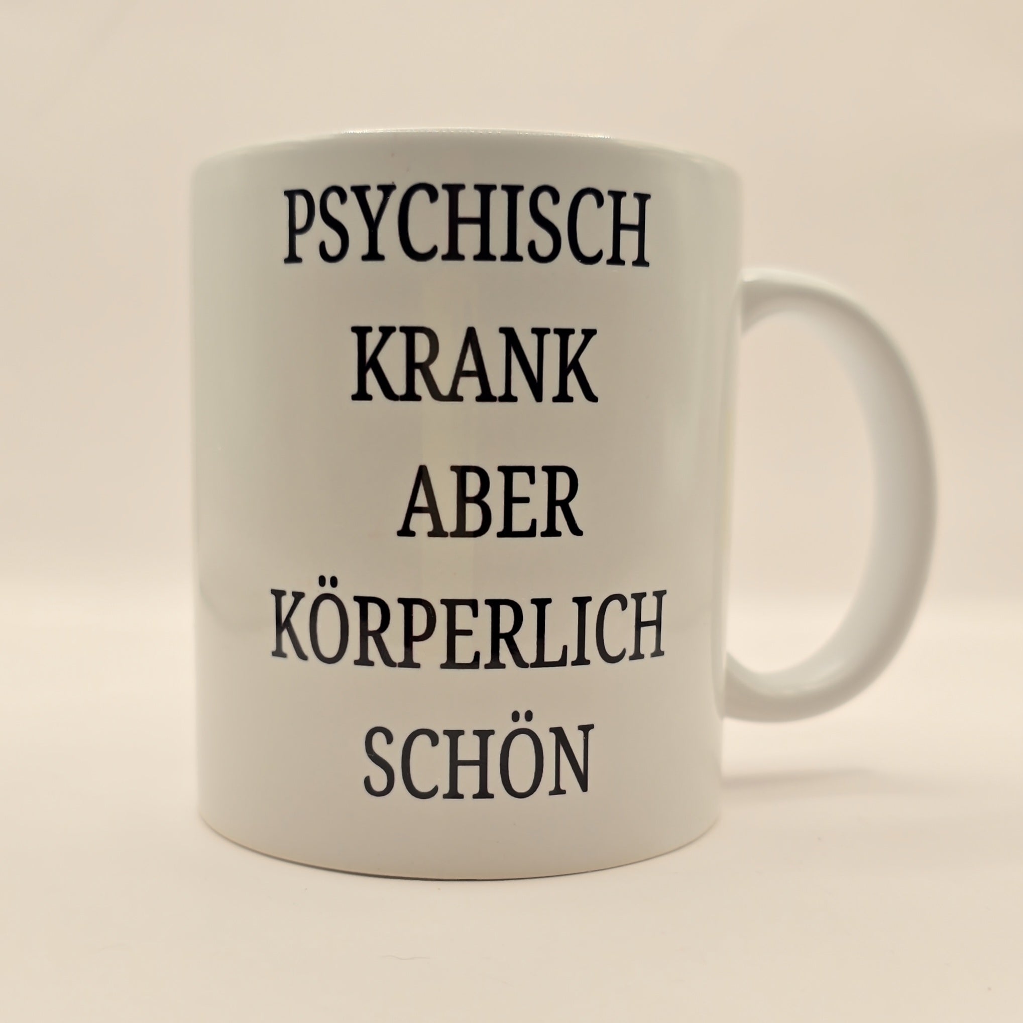 Tasse „Psychisch krank, aber körperlich schön“